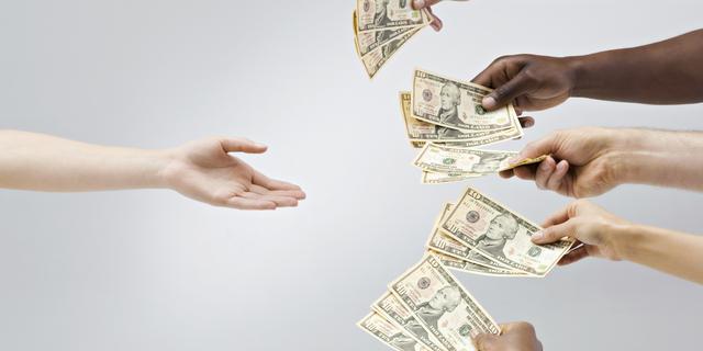 Hands holding out money, one hand receiving