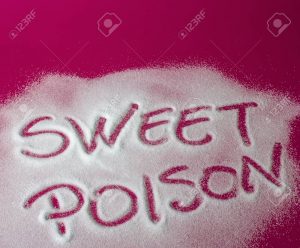 Sugar on a red background with warning message SWEET POISON written on it. Health concept. Diabetes hazard