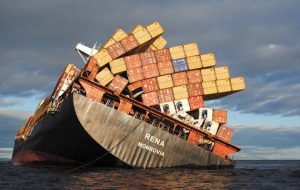 TAURANGA, NEW ZEALAND - OCTOBER 20: In this handout provided by the New Zealand Defence Force, the stern of the stranded cargo vessel Rena grounded on the Astrolabe Reef is seen on October 20, 2011 in Tauranga, New Zealand. Salvage crews continue to pump oil off the ship in an effort to remove as much as possible before bad weather predicted for the evening threatens to break the vessel and release more oil into the sea. Over 300 tonnes of oil has leaked from Rena since it hit the reef on October 5. (Photo by New Zealand Defence Force via Getty Images)